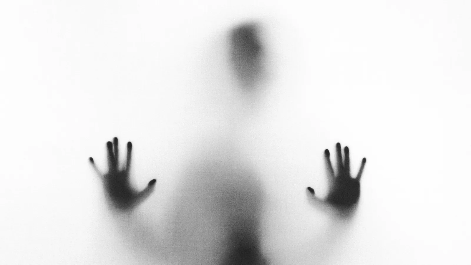 A reflective, low-light photograph accompanying an article on the difference between everyday sadness and depression.