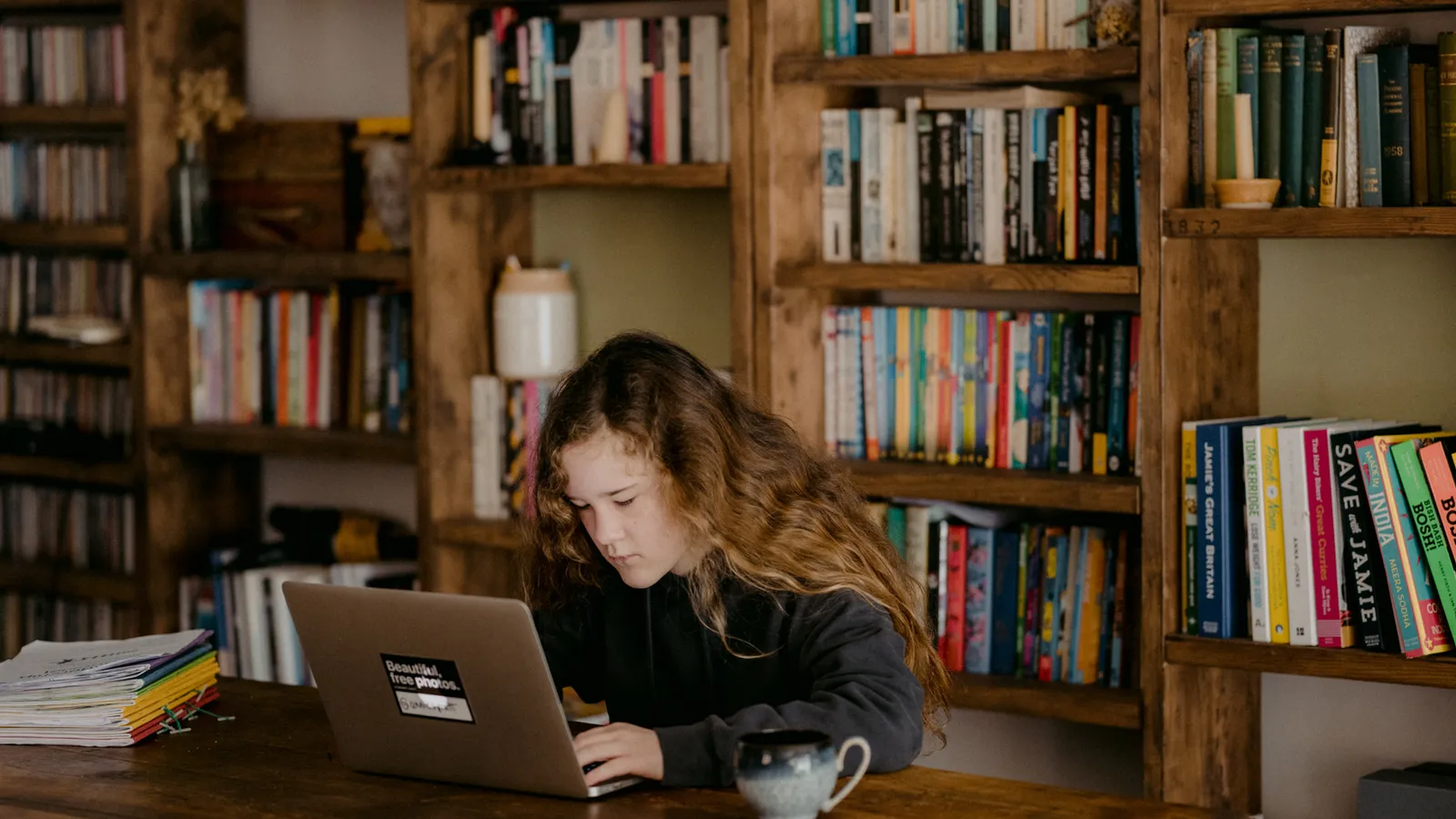 A young person studying at home with their laptop, used here to evoke the question of what good study looks like when AI is in the mix.